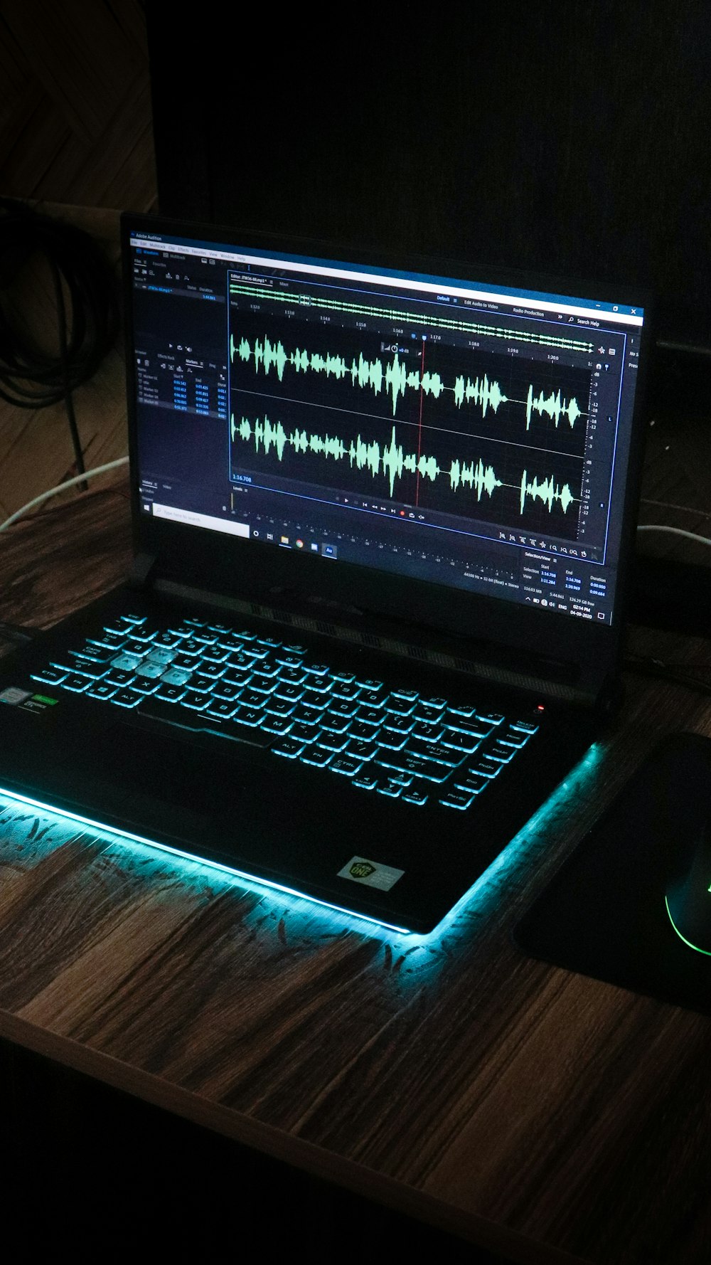 black laptop computer on brown wooden table