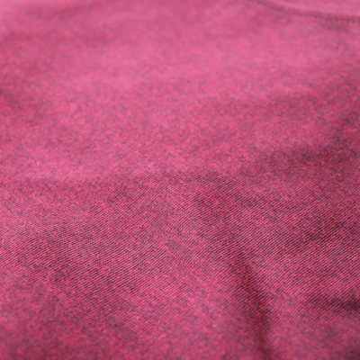 Close-up of high-quality fabric samples in maroon, black, and white colors.