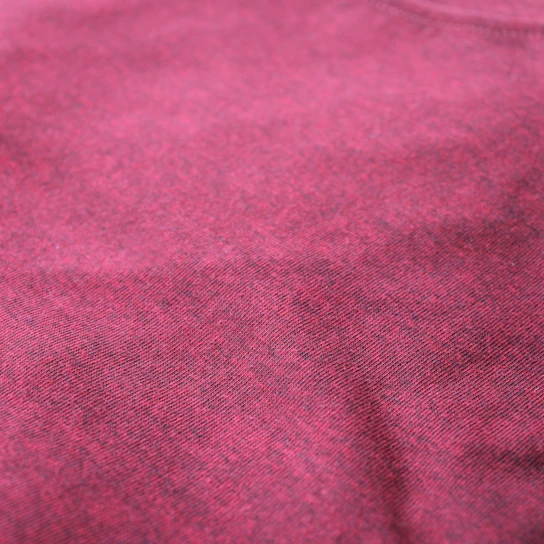 Close-up of rich maroon fabric texture with fine stitching details