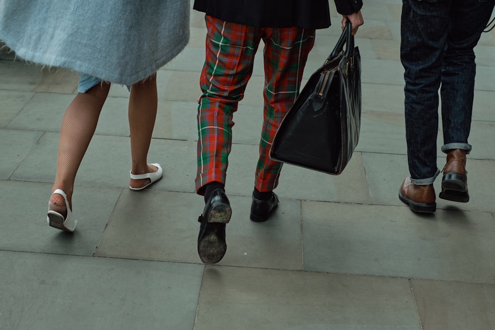 woman in red and black plaid pants and red shoes