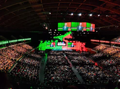 Image showing the auditorium of Hospital Santa Lúcia filled with attentive congress attendees.