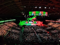 A panoramic view of the conference venue filled with attendees.