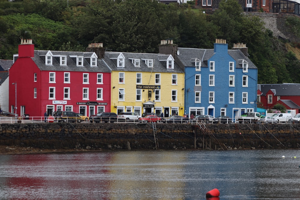 red and white houses near river during daytime