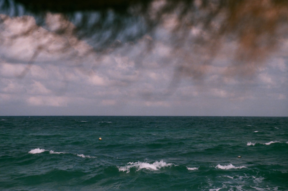 blue sea under white sky during daytime