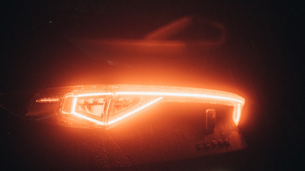 red car on road during night time