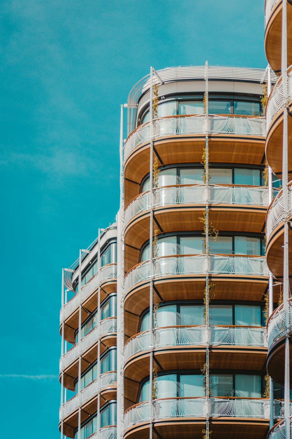 brown and white concrete building under blue sky during daytime