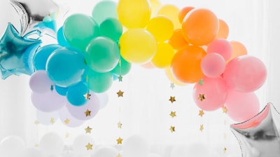 blue and yellow balloons with white clouds