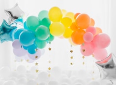 blue and yellow balloons with white clouds
