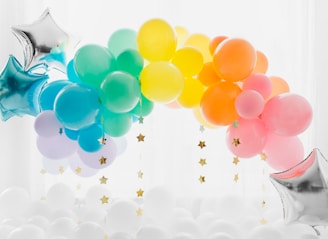 blue and yellow balloons with white clouds