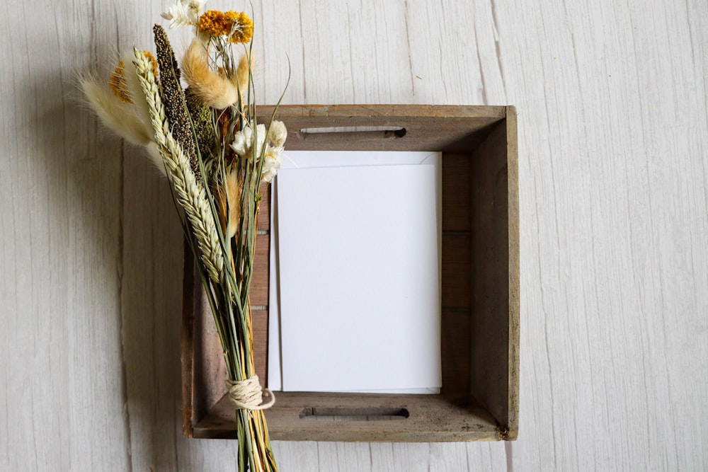 yellow flowers on white wooden wall mounted rack