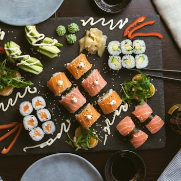 sushi on black ceramic plate