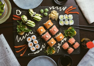 sushi on black ceramic plate