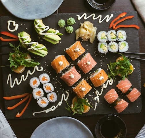 sushi on black ceramic plate