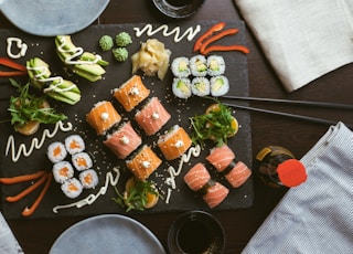 sushi on black ceramic plate