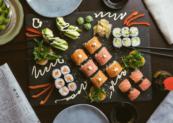 sushi on black ceramic plate