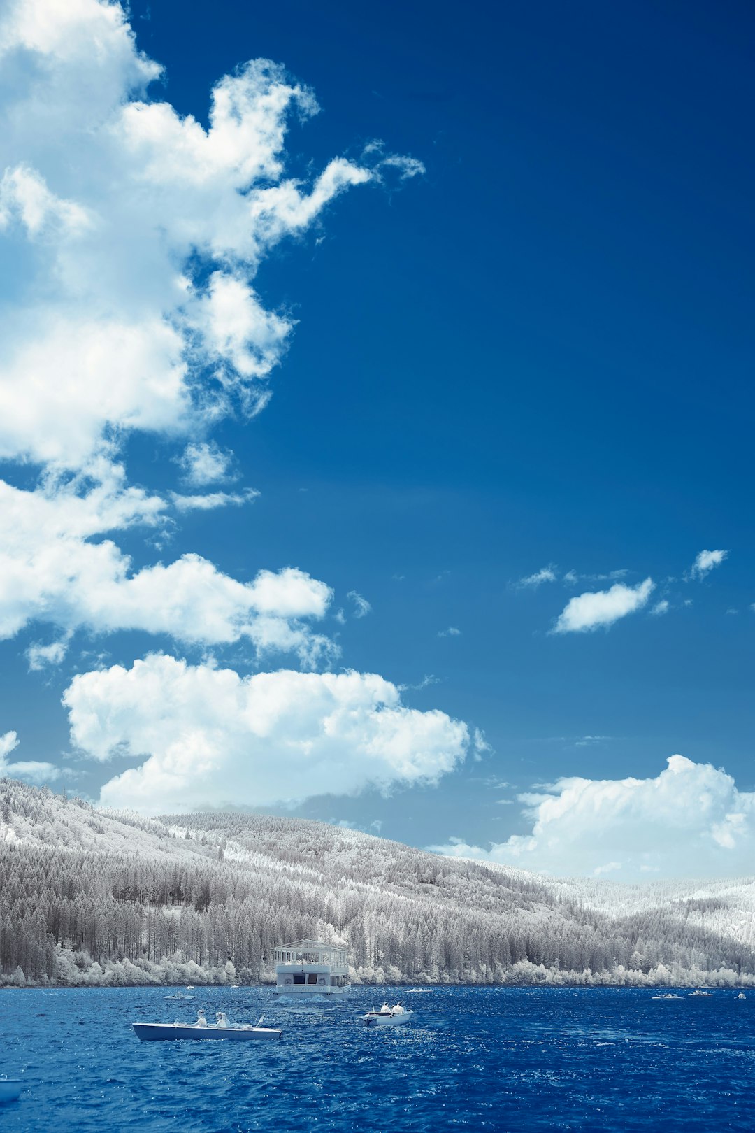 white clouds over snow covered mountains