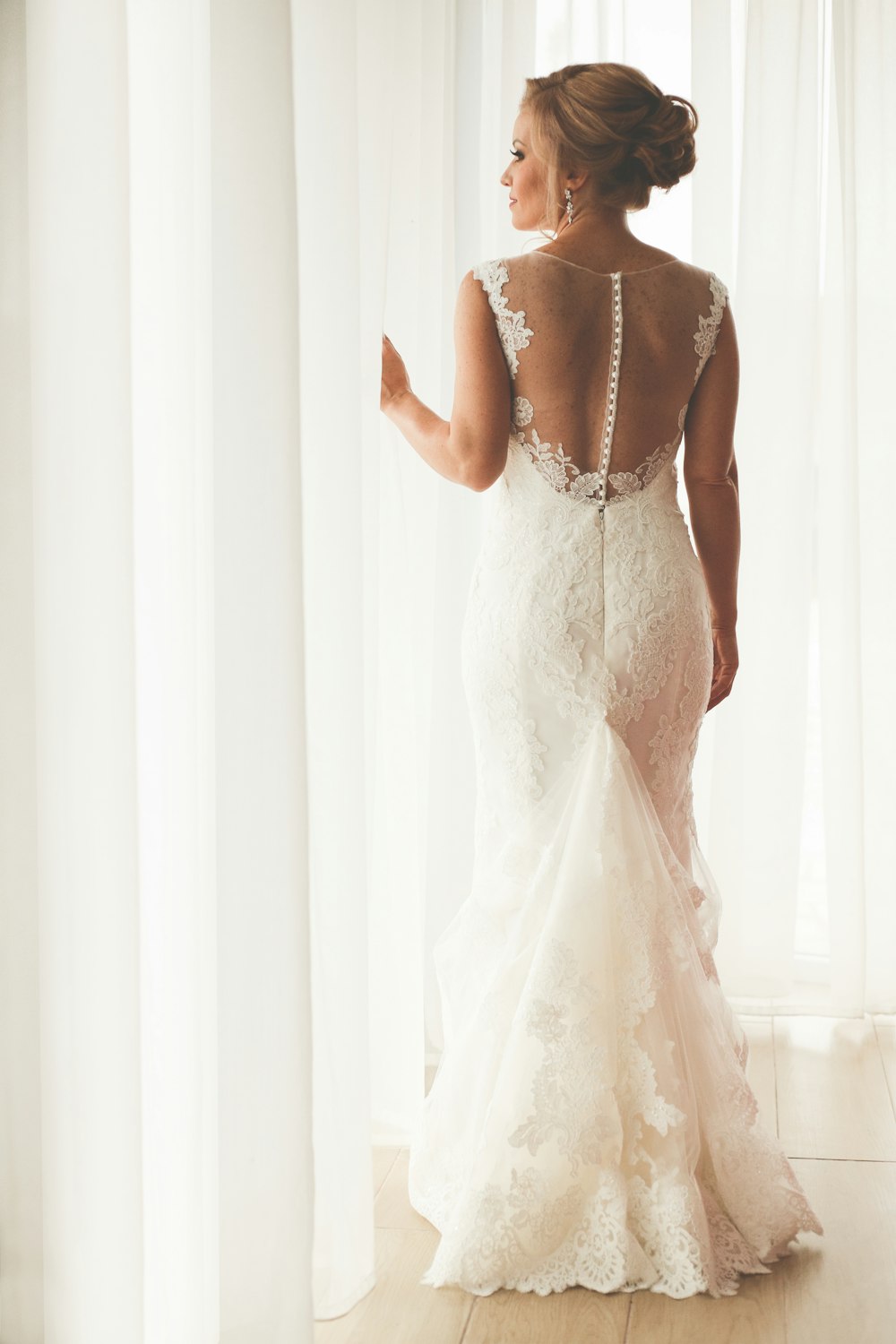 woman in white floral lace dress