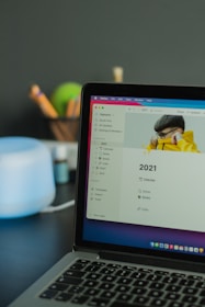 black laptop computer turned on displaying facebook