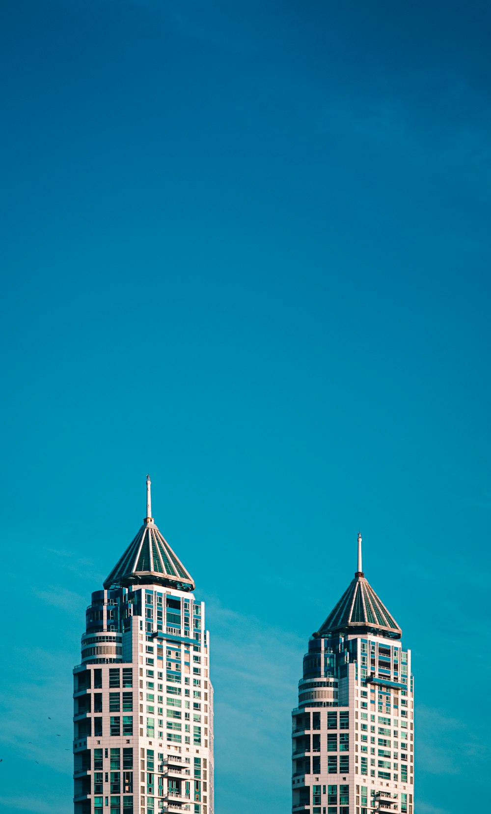 white and brown concrete building under blue sky during daytime