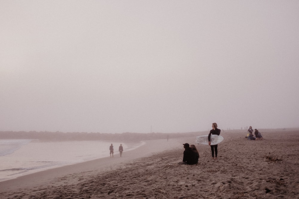 people walking on beach during daytime