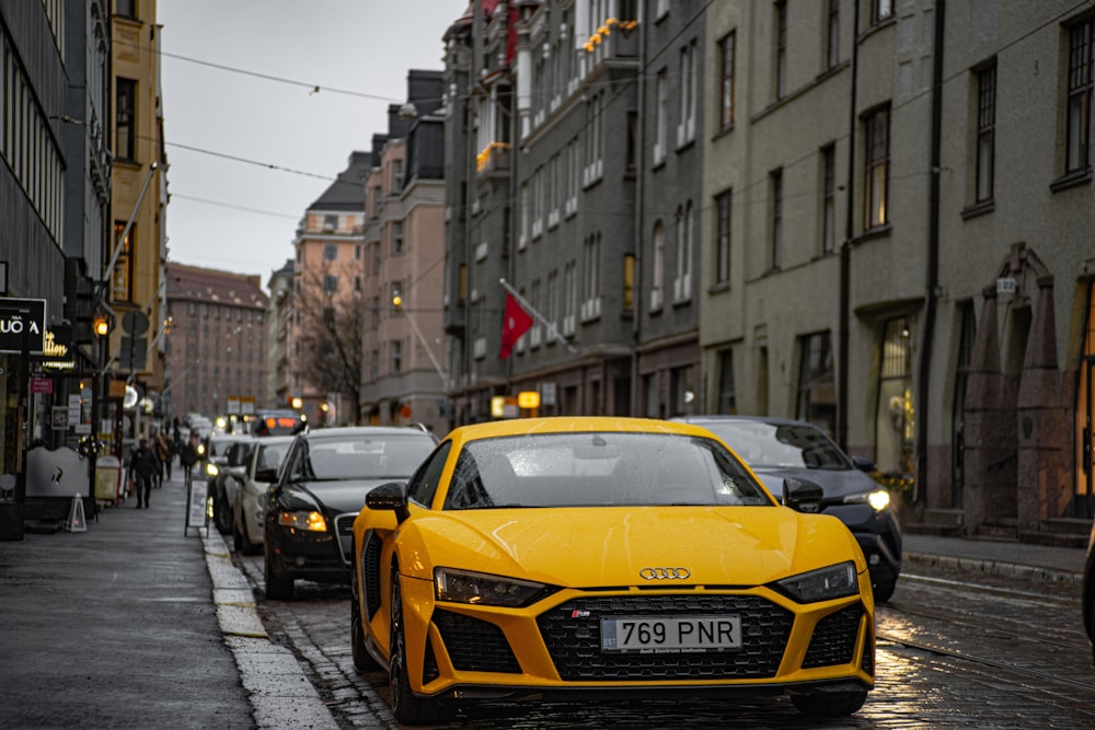 yellow porsche 911 on road during daytime