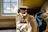 white and brown chihuahua lying on blue textile