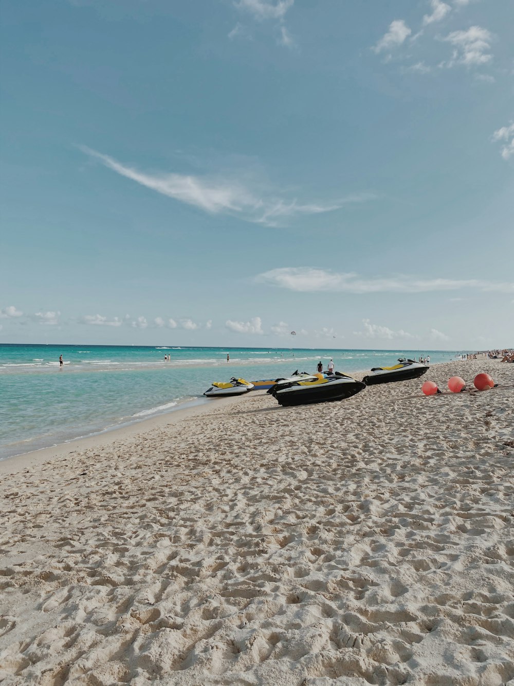 yellow and black boat on beach during daytime