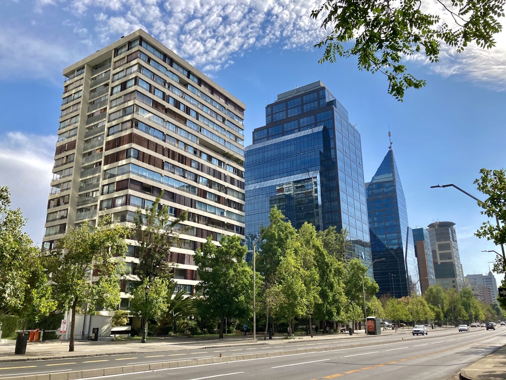 green trees near white concrete building during daytime