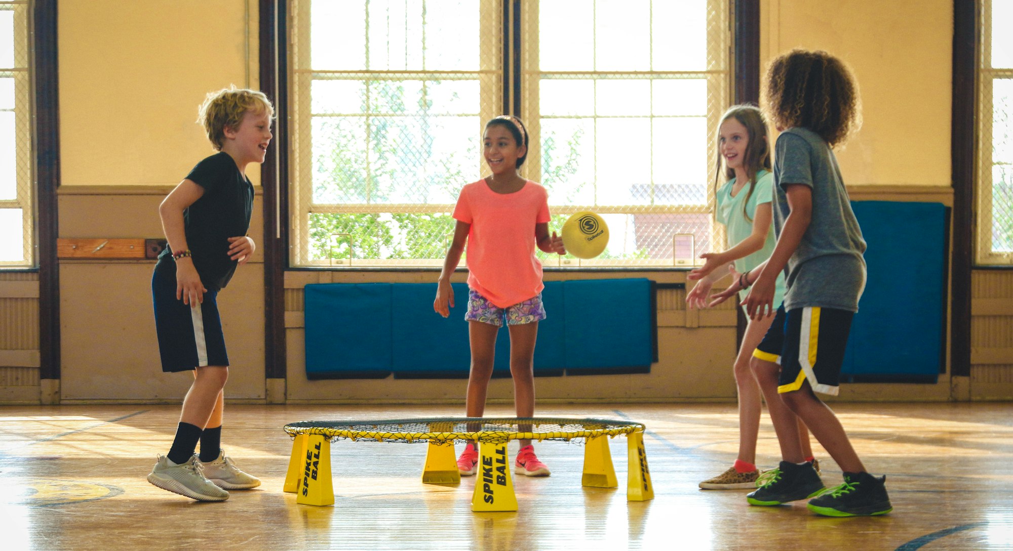 Kids playing Spikeball on a Spikeball Rookie Kit