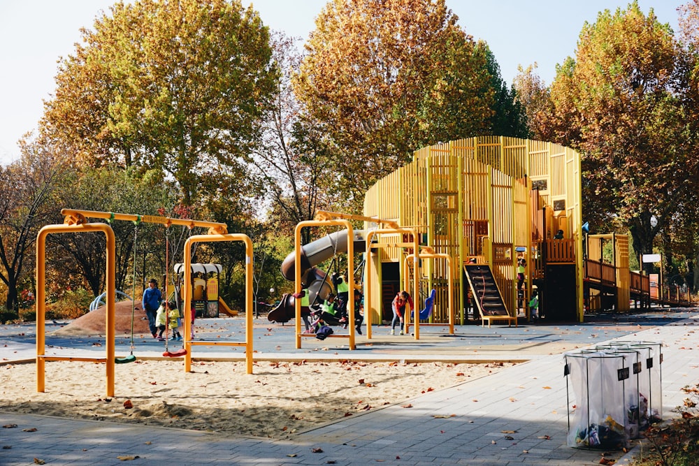 people standing near yellow building during daytime