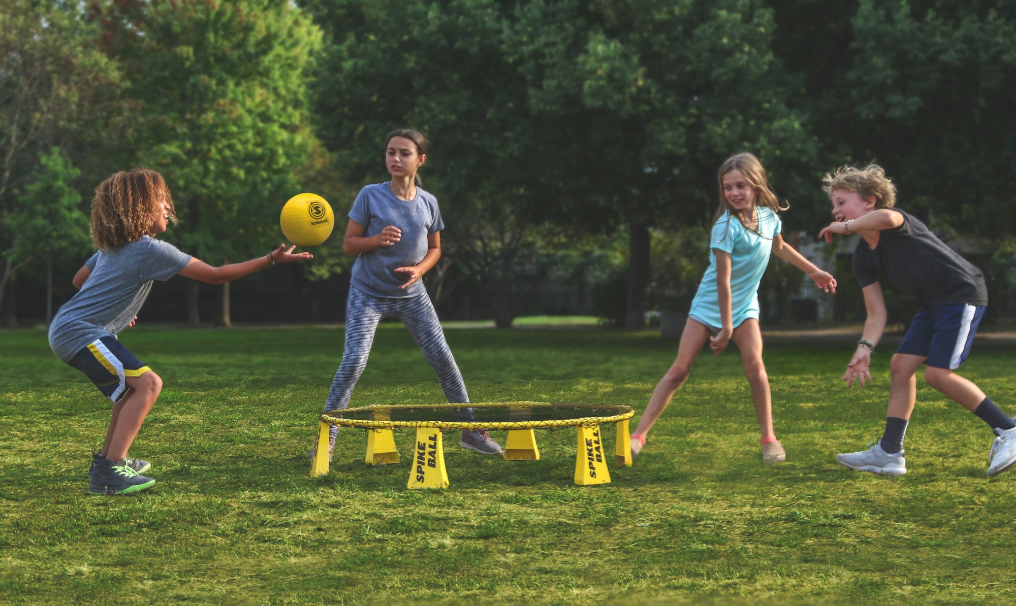 Kids playing Spikeball on the Spikeball Rookie Kit