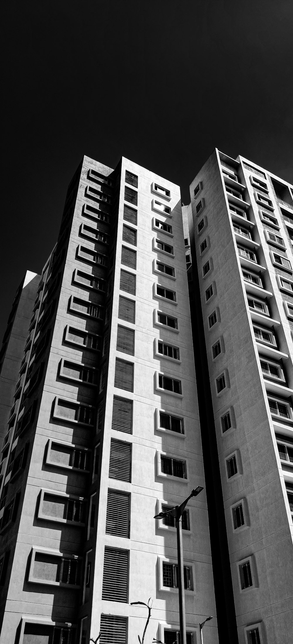 grayscale photo of high rise building