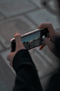 person holding silver iphone 6