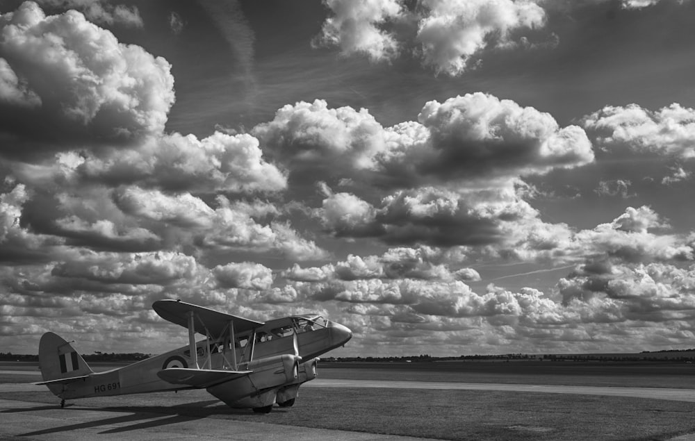 grayscale photo of airplane on the sea