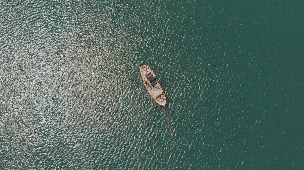 aerial view of boat on sea during daytime