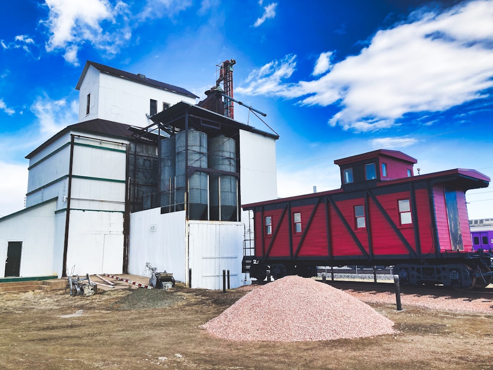 white and red concrete building under blue sky during daytime