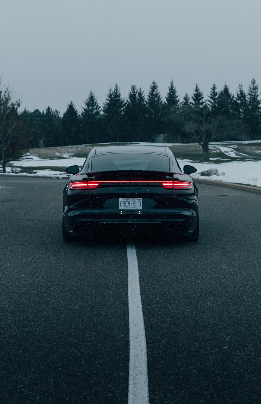 black car on road during daytime