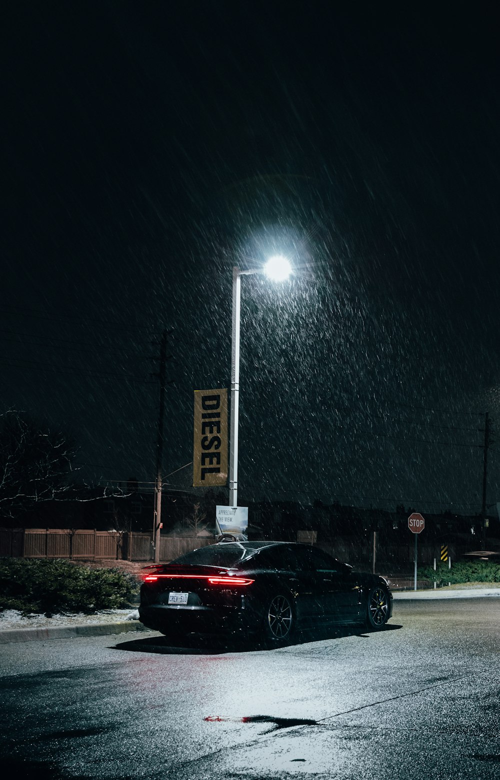 black car on road during night time