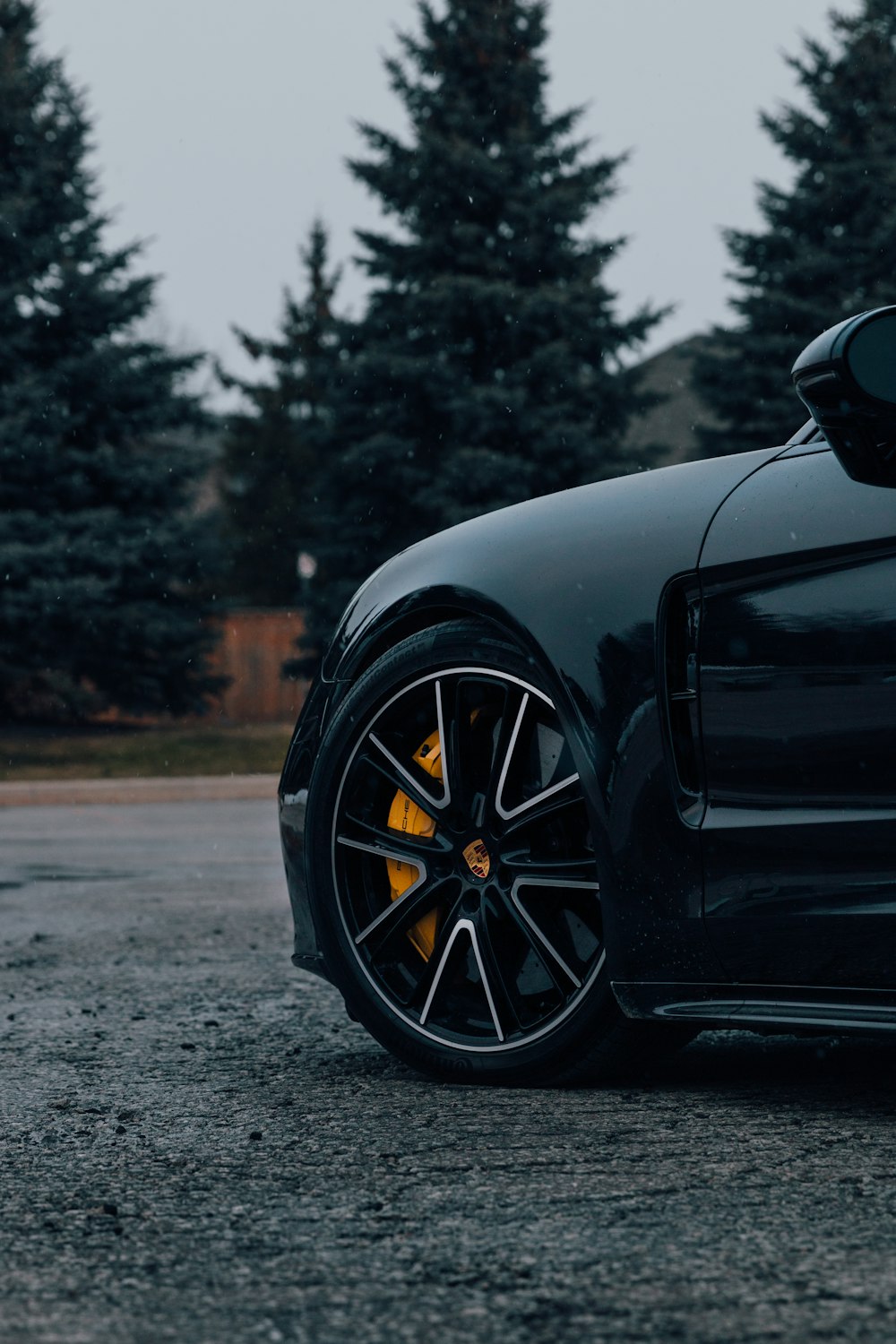 black car on gray asphalt road during daytime