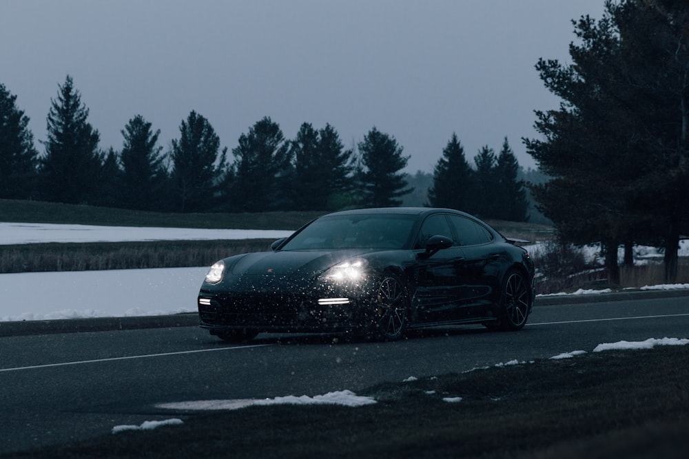 black bmw coupe on road during daytime