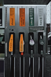 a row of gas pumps sitting next to each other