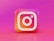 A 3D, colorful depiction of the Instagram logo, featuring a gradient background of pink and orange hues.
