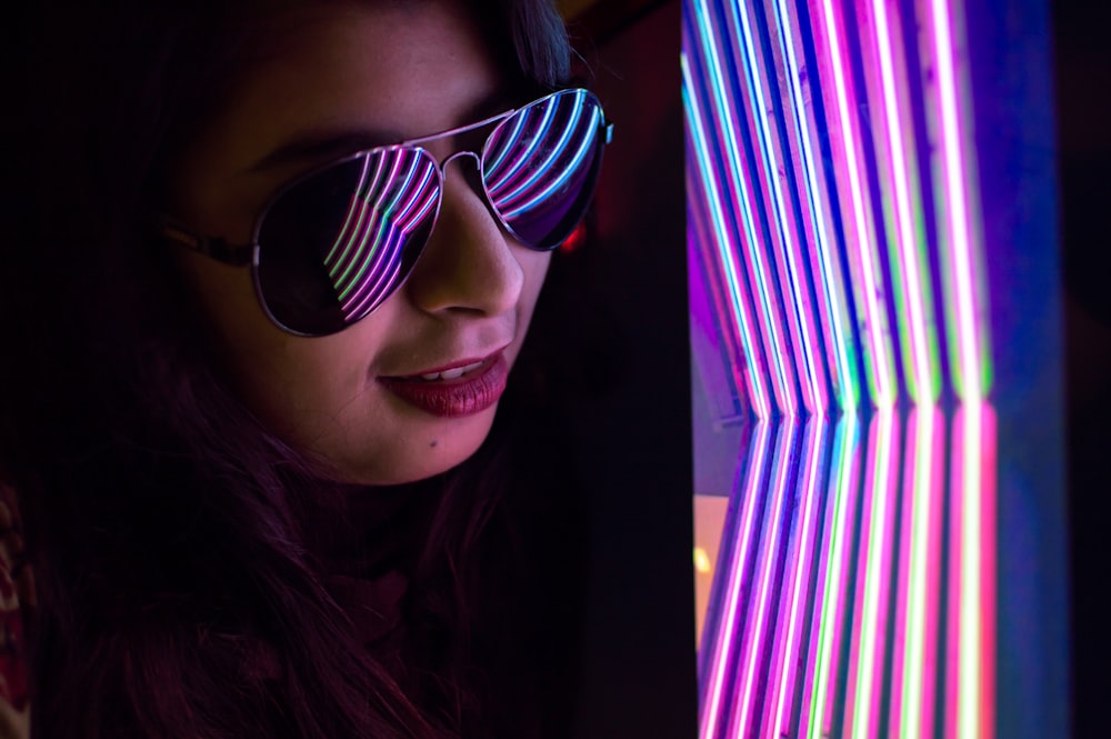 woman wearing black sunglasses taking selfie