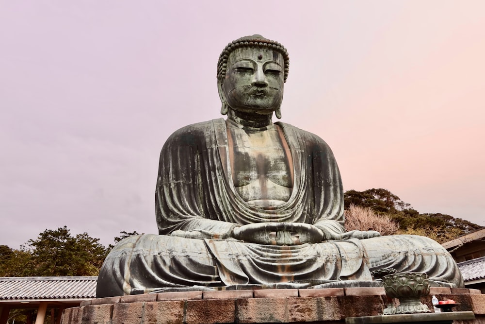 gray concrete statue of a man