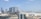 A panoramic view of the Abu Dhabi skyline with modern architecture.