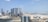 A panoramic view of the Abu Dhabi skyline with modern architecture.