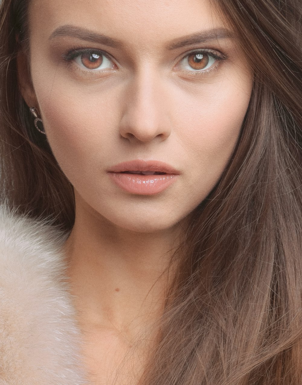 woman in white fur coat