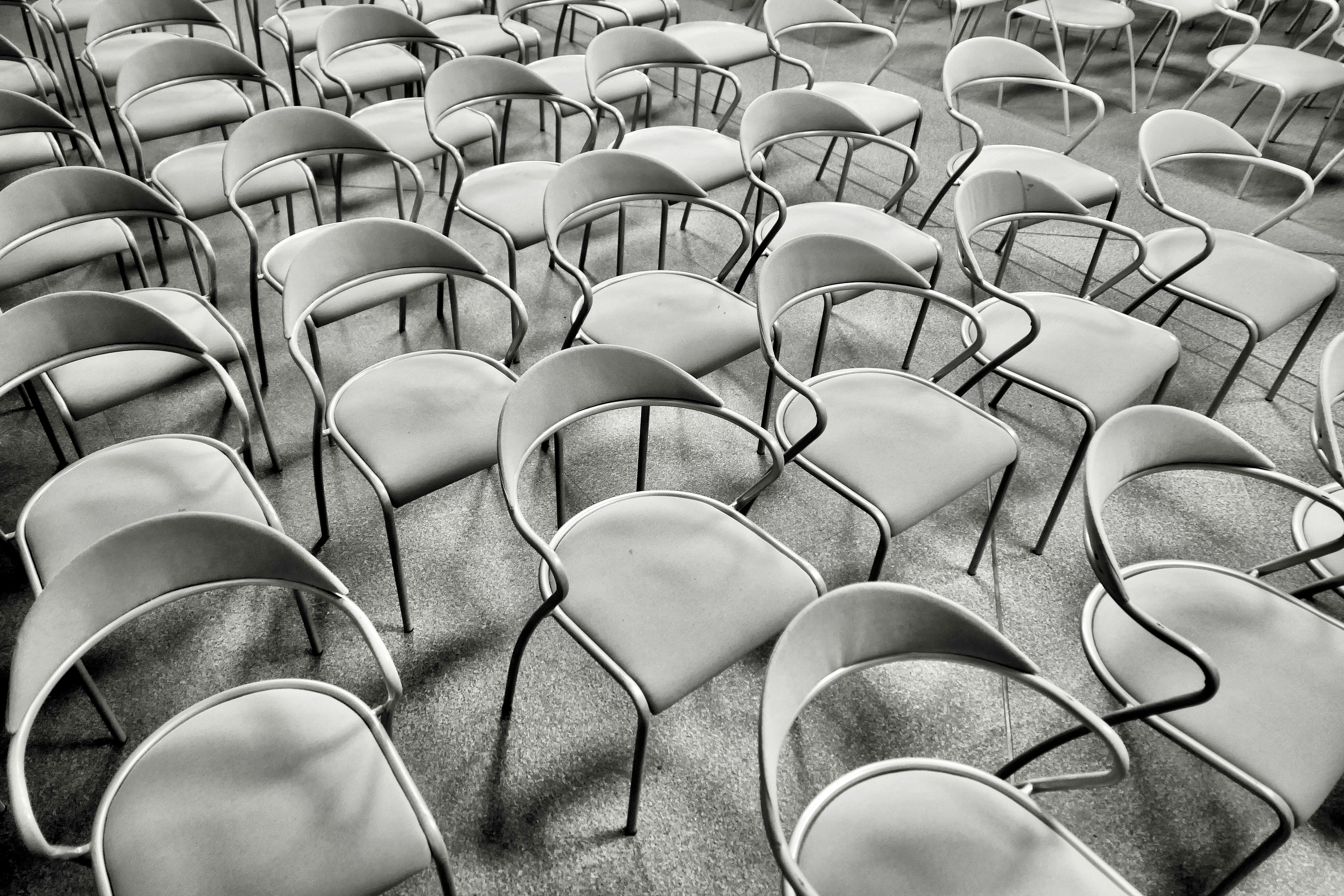 gray metal chair on gray concrete floor