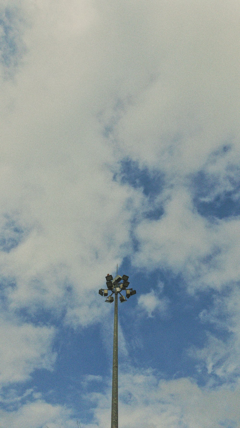 white and black cross under blue sky