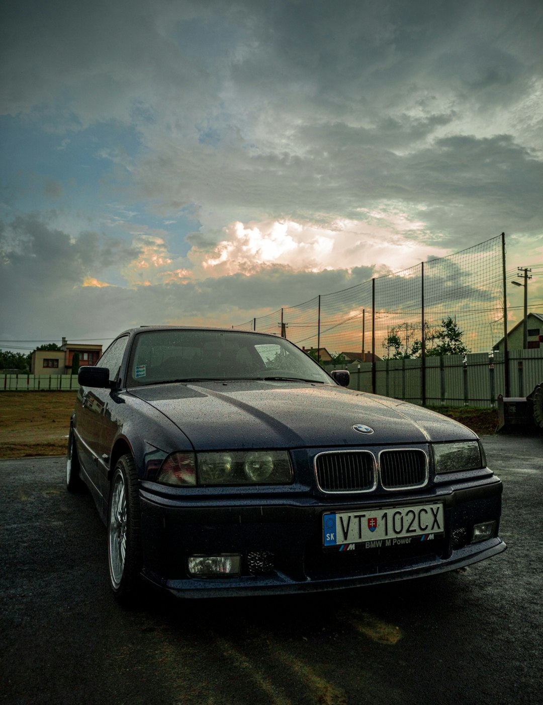 black bmw m 3 parked on parking lot during daytime